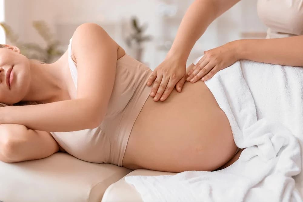Side-lying prenatal massage with cushion support